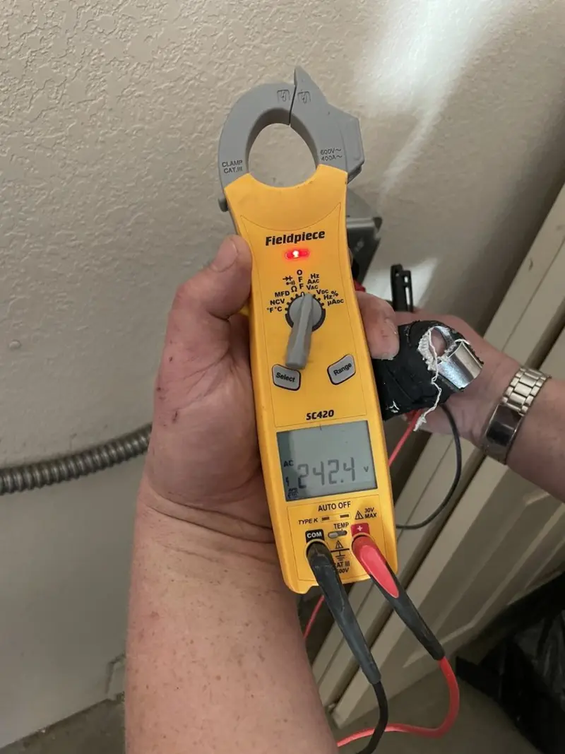 Voltage testing with clamp meter during Electrical Installation Services in Willow Springs